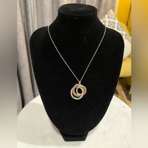Barely worn Tiffany & Co interlocking ring pendant.